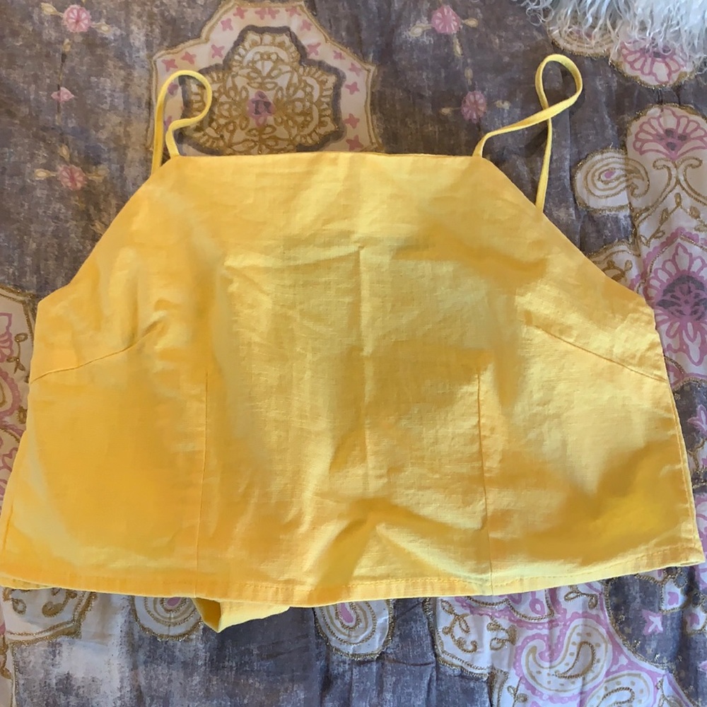 Yellow top with adjustable straps and ties in the back